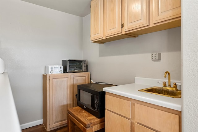 2813 Pine Lakes Ct, Stevensville, MT 59870 - laundry room featuring a sink and baseboards