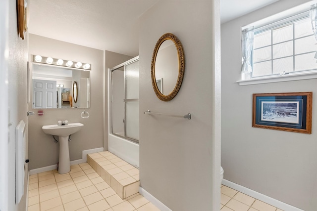 2813 Pine Lakes Ct, Stevensville, MT 59870 - full bath featuring tile patterned flooring and shower / bath combination with glass door