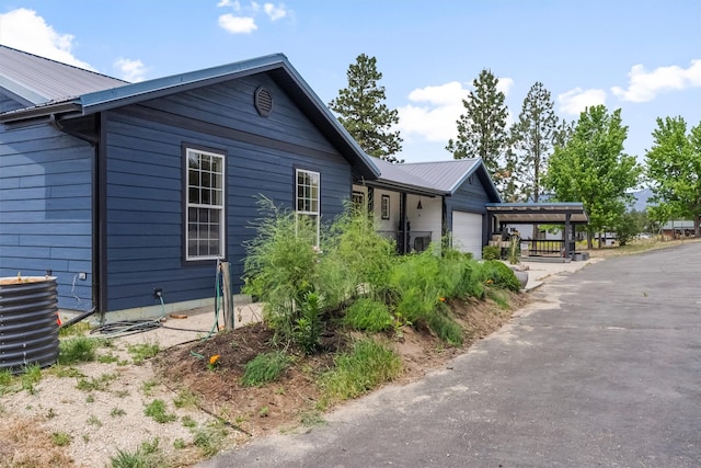 2813 Pine Lakes Ct, Stevensville, MT 59870 - single story home with an attached garage and a metal roof