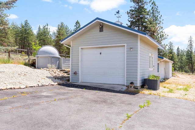 2813 Pine Lakes Ct, Stevensville, MT 59870 - detached garage featuring asphalt driveway