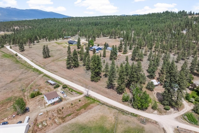 2813 Pine Lakes Ct, Stevensville, MT 59870 - aerial view of property and surrounding area with a forest and a mountainous background