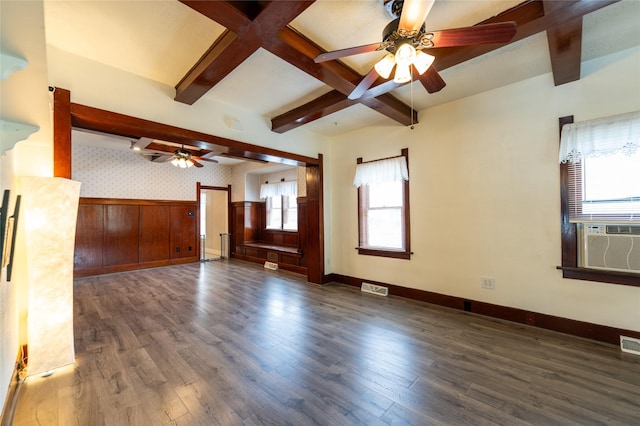 1805 2nd Ave N, Great Falls, MT 59401 - unfurnished living room featuring a ceiling fan, beamed ceiling, a wainscoted wall, wood finished floors, and cooling unit