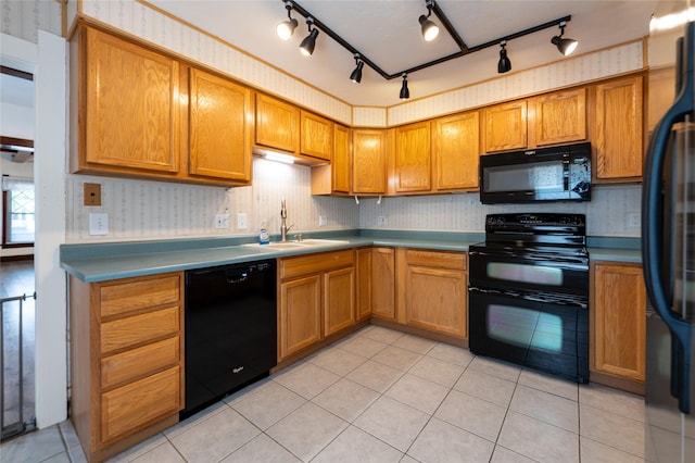 1805 2nd Ave N, Great Falls, MT 59401 - kitchen with black appliances, brown cabinets, light tile patterned floors, and track lighting