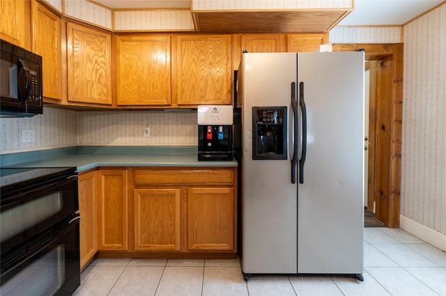 1805 2nd Ave N, Great Falls, MT 59401 - kitchen featuring black appliances, wallpapered walls, light tile patterned floors, and brown cabinets
