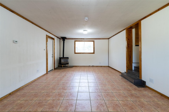 1805 2nd Ave N, Great Falls, MT 59401 - unfurnished living room with a wood stove and light tile patterned floors