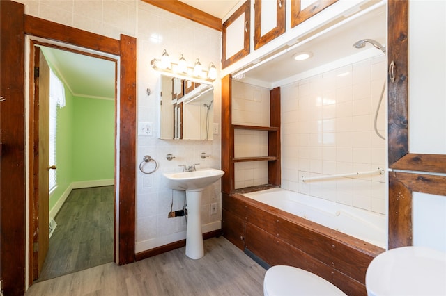 1805 2nd Ave N, Great Falls, MT 59401 - full bath with tile walls, a bathtub, wood finished floors, and ornamental molding