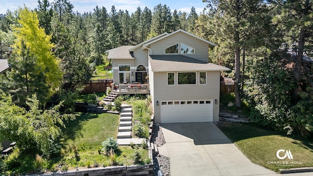 2623 Gold Rush Ave, Helena, MT 59601 - view of front of house featuring stairway, concrete driveway, a garage, a front yard, and a shingled roof