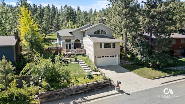 2623 Gold Rush Ave, Helena, MT 59601 - view of front of house with driveway, a garage, stairs, a deck, and a shingled roof