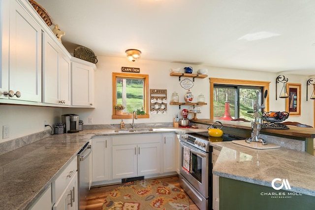 2623 Gold Rush Ave, Helena, MT 59601 - kitchen featuring appliances with stainless steel finishes, white cabinetry, light wood-type flooring, light stone countertops, and open shelves