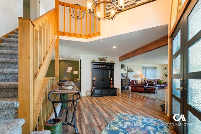 2623 Gold Rush Ave, Helena, MT 59601 - living room featuring wood finished floors, stairs, a chandelier, and beam ceiling