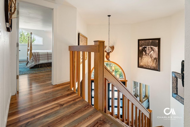 2623 Gold Rush Ave, Helena, MT 59601 - corridor with wood finished floors, a chandelier, and an upstairs landing