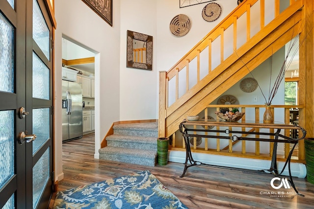 2623 Gold Rush Ave, Helena, MT 59601 - foyer entrance featuring stairway, wood finished floors, a towering ceiling, and french doors