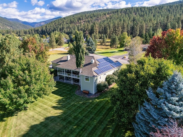 8785 Jacot Ln, Missoula, MT 59808 - aerial view of property and surrounding area featuring a heavily wooded area and a mountainous background