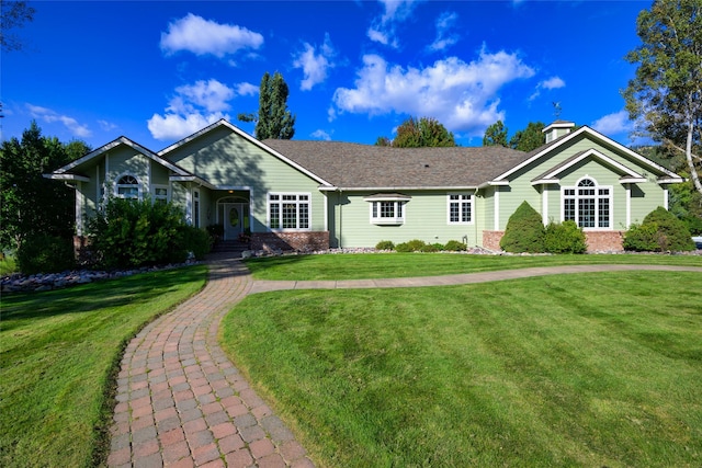 8785 Jacot Ln, Missoula, MT 59808 - single story home with brick siding and a front lawn