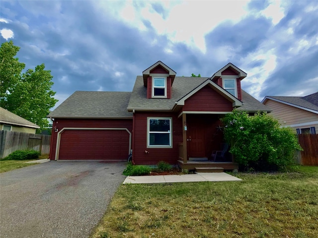 1109 Wyoming St, Belgrade, MT 59714 - view of front of property with driveway, a garage, and a shingled roof