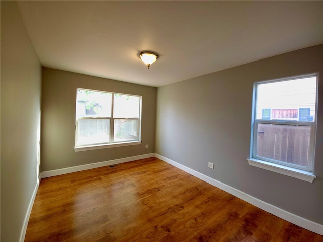 1109 Wyoming St, Belgrade, MT 59714 - spare room featuring wood finished floors and baseboards