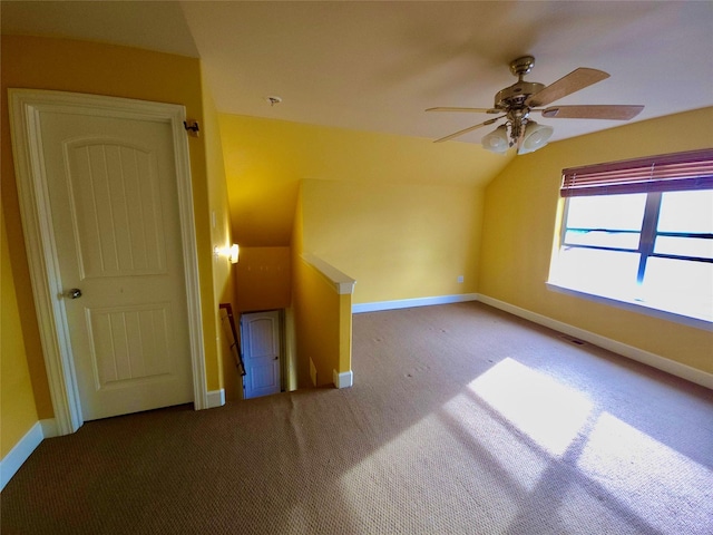 1109 Wyoming St, Belgrade, MT 59714 - carpeted spare room featuring a ceiling fan, lofted ceiling, and a pendent fire sprinkler