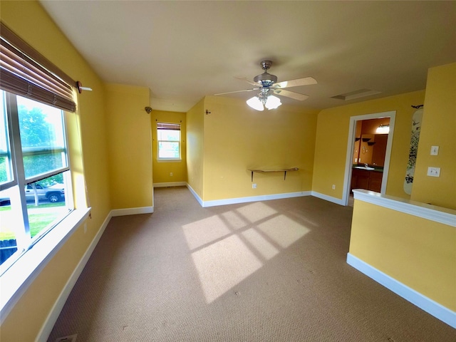 1109 Wyoming St, Belgrade, MT 59714 - carpeted spare room featuring a ceiling fan and baseboards
