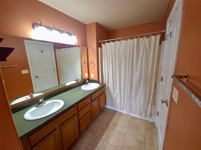 1109 Wyoming St, Belgrade, MT 59714 - full bath featuring double vanity, tile patterned floors, and shower / tub combo
