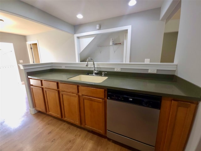 1109 Wyoming St, Belgrade, MT 59714 - kitchen featuring dishwasher, brown cabinetry, dark countertops, light wood finished floors, and recessed lighting