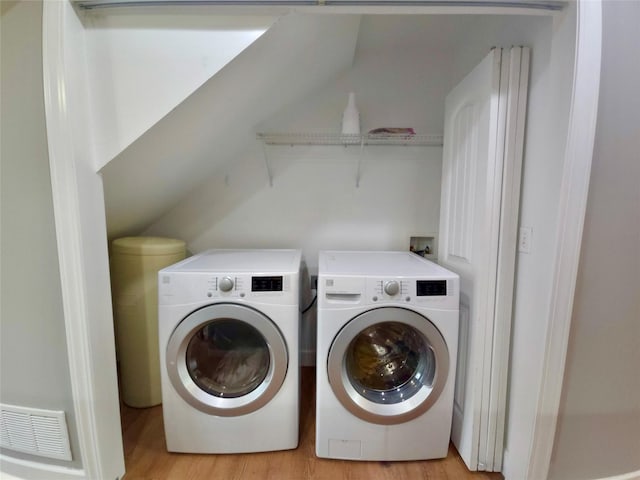 1109 Wyoming St, Belgrade, MT 59714 - laundry area with independent washer and dryer and light wood-style floors