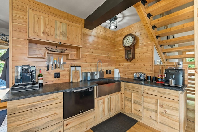 298 Lone Wolf Trl, Lakeside, MT 59922 - kitchen featuring dishwasher, wooden walls, light brown cabinets, and dark countertops