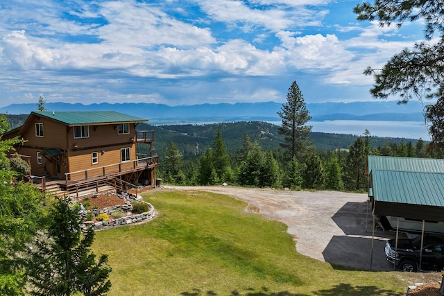 298 Lone Wolf Trl, Lakeside, MT 59922 - view of green lawn featuring a mountain view and a forest view