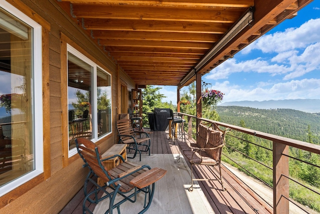 298 Lone Wolf Trl, Lakeside, MT 59922 - wooden terrace with a mountain view and area for grilling