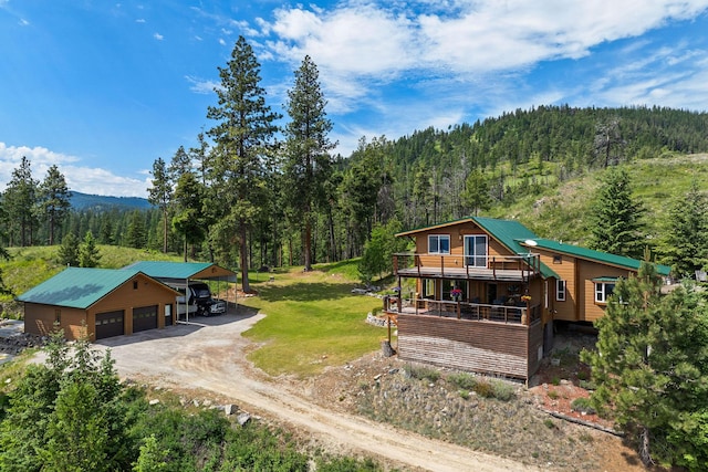 298 Lone Wolf Trl, Lakeside, MT 59922 - view of subject property with a heavily wooded area