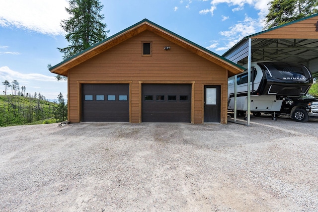 298 Lone Wolf Trl, Lakeside, MT 59922 - view of front of home featuring an outbuilding and a detached garage