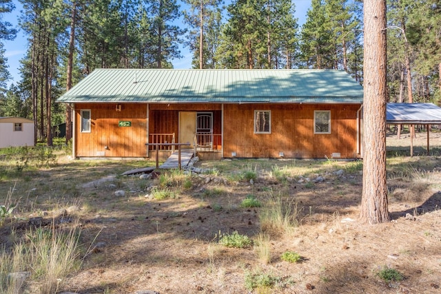 452 Blair Ln, Victor, MT 59875 - view of front of property featuring a metal roof, a porch, and a standing seam roof