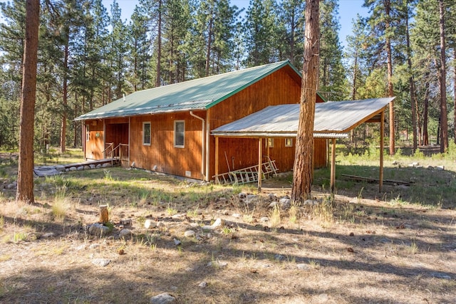 452 Blair Ln, Victor, MT 59875 - view of side of property with a carport and a metal roof