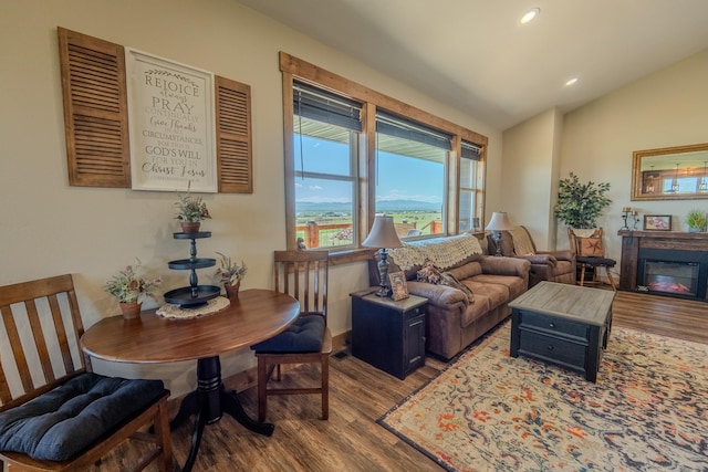 51 Whitehorse Rd, Townsend, MT 59644 - living area featuring wood finished floors, vaulted ceiling, recessed lighting, and a glass covered fireplace