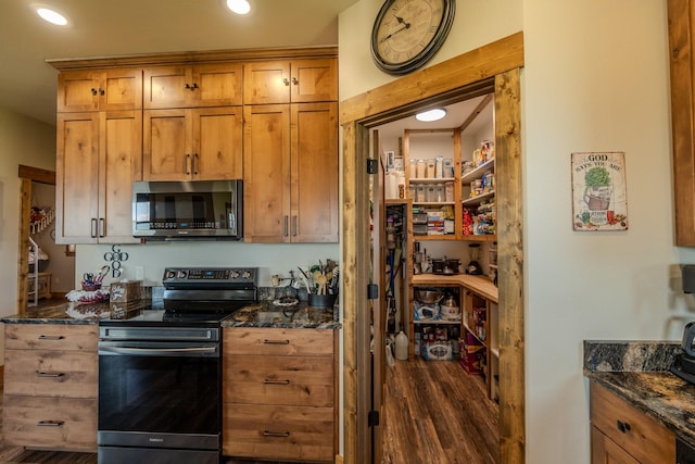 51 Whitehorse Rd, Townsend, MT 59644 - kitchen with stainless steel microwave, electric range oven, dark wood finished floors, dark stone countertops, and recessed lighting