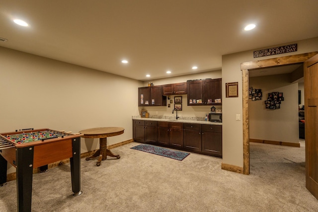 51 Whitehorse Rd, Townsend, MT 59644 - indoor wet bar featuring light colored carpet, recessed lighting, and black microwave