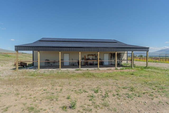51 Whitehorse Rd, Townsend, MT 59644 - rear view of property with an exterior structure, an outbuilding, a metal roof, and a mountain view