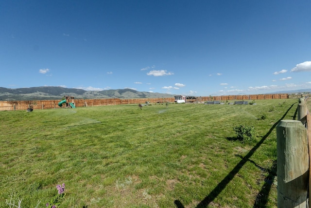 51 Whitehorse Rd, Townsend, MT 59644 - fenced backyard with a playground, a view of rural / pastoral area, and a mountain view