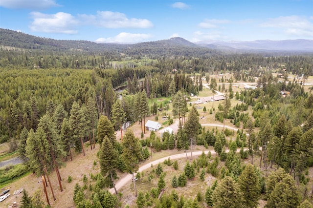 752 Grizzly Dr, Seeley Lake, MT 59868 - aerial view of a heavily wooded area and a mountainous background