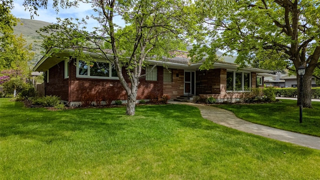 1700 Arthur Ave, Missoula, MT 59801 - view of front of property with a front yard and brick siding