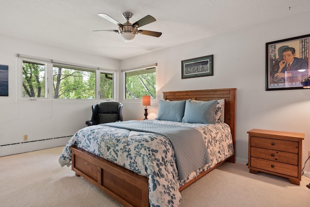 1700 Arthur Ave, Missoula, MT 59801 - carpeted bedroom with baseboard heating and ceiling fan