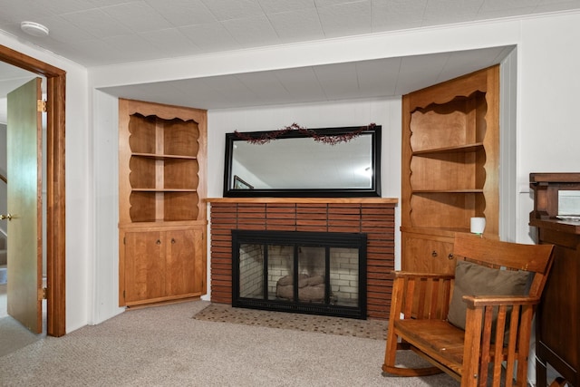 1700 Arthur Ave, Missoula, MT 59801 - living room featuring a brick fireplace, built in features, and carpet flooring