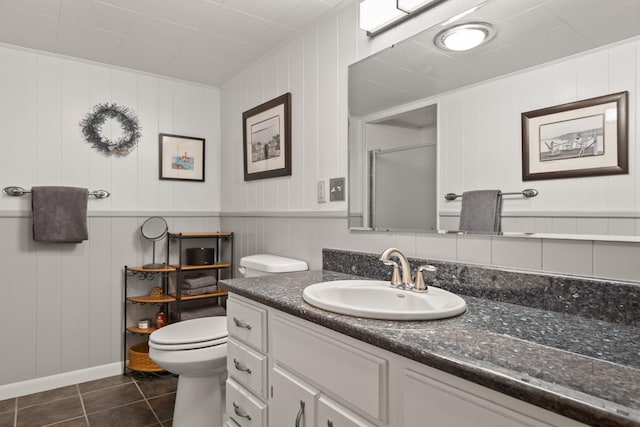 1700 Arthur Ave, Missoula, MT 59801 - full bath with vanity, tile patterned flooring, a shower with door, and a decorative wall