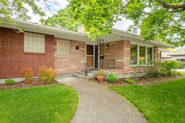 1700 Arthur Ave, Missoula, MT 59801 - entrance to property featuring a chimney, a yard, brick siding, and stone siding