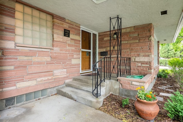 1700 Arthur Ave, Missoula, MT 59801 - property entrance featuring a porch and brick siding