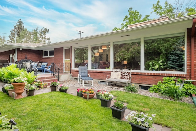 1700 Arthur Ave, Missoula, MT 59801 - rear view of house with a lawn and brick siding