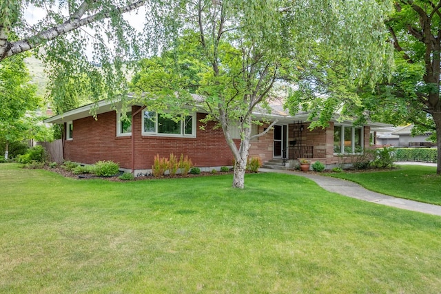 1700 Arthur Ave, Missoula, MT 59801 - ranch-style home featuring a front yard and brick siding