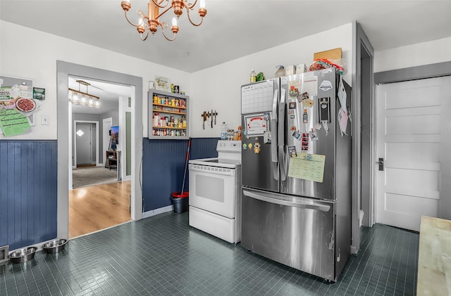 1126 4th Ave S, Great Falls, MT 59405 - kitchen featuring freestanding refrigerator, white electric range, a chandelier, and light countertops