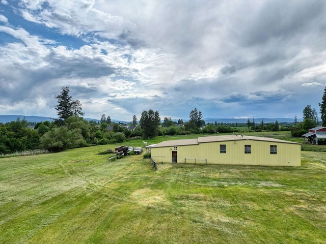 791 Springwood Ln, Kalispell, MT 59901 - view of grassy yard featuring a pole building and an outdoor structure