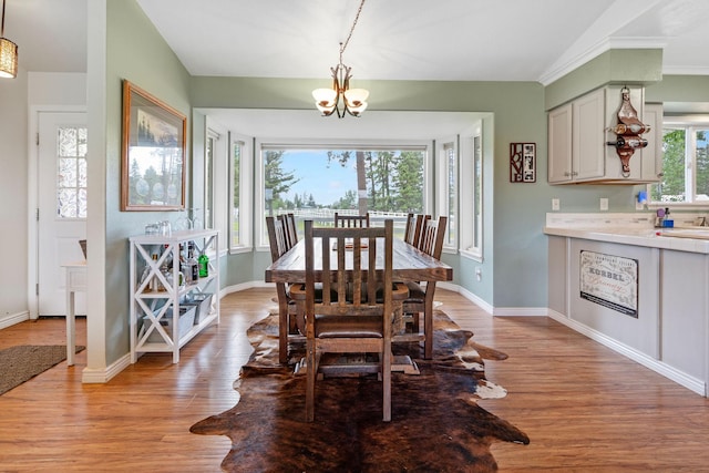 791 Springwood Ln, Kalispell, MT 59901 - dining space with light wood-style floors and a chandelier