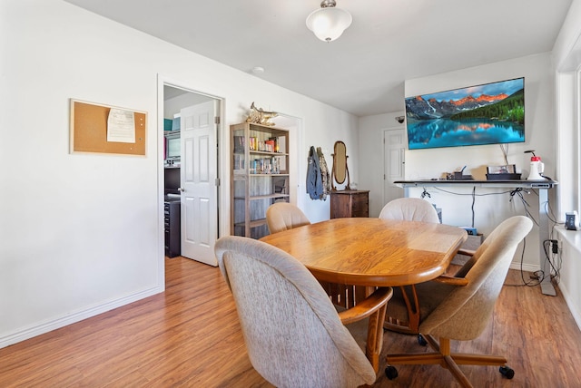 791 Springwood Ln, Kalispell, MT 59901 - dining space with light wood-style flooring and baseboards